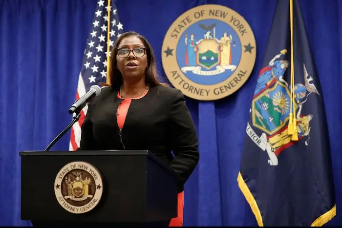 New York State Attorney General Letitia James standing at a podium to announce that the state is suing the National Rifle Association during a press conference, in New York.
